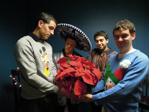 Mario (second from right) clearly shines in his exceptional multi-color sweater.